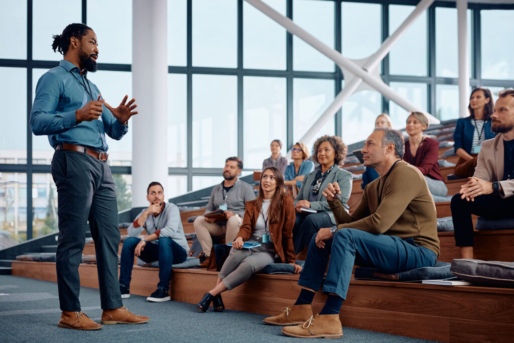 African,American,Business,Coach,Giving,A,Speech,To,Group,Of